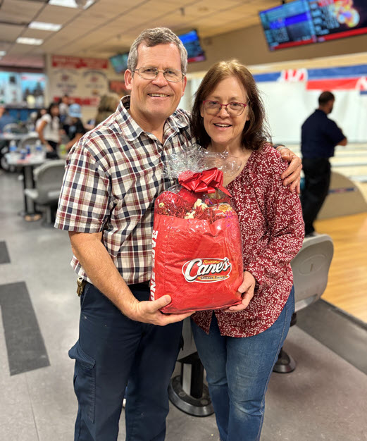 Summer Picnic 3 Man and woman holding a prize in bowling alley