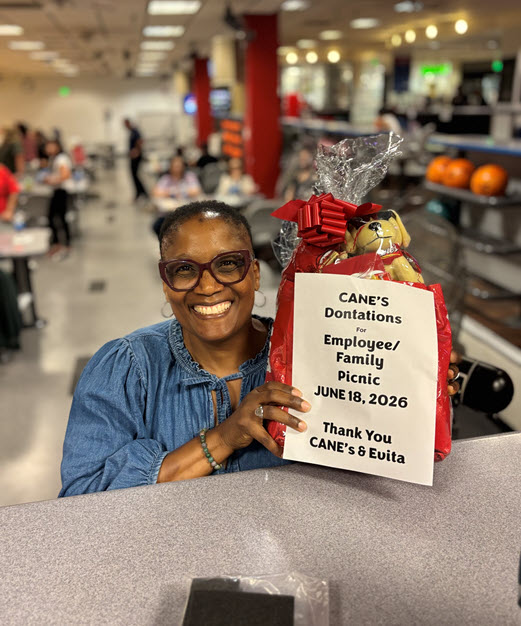 Summer Picnic 4 Woman in bowling alley holding a prize gift