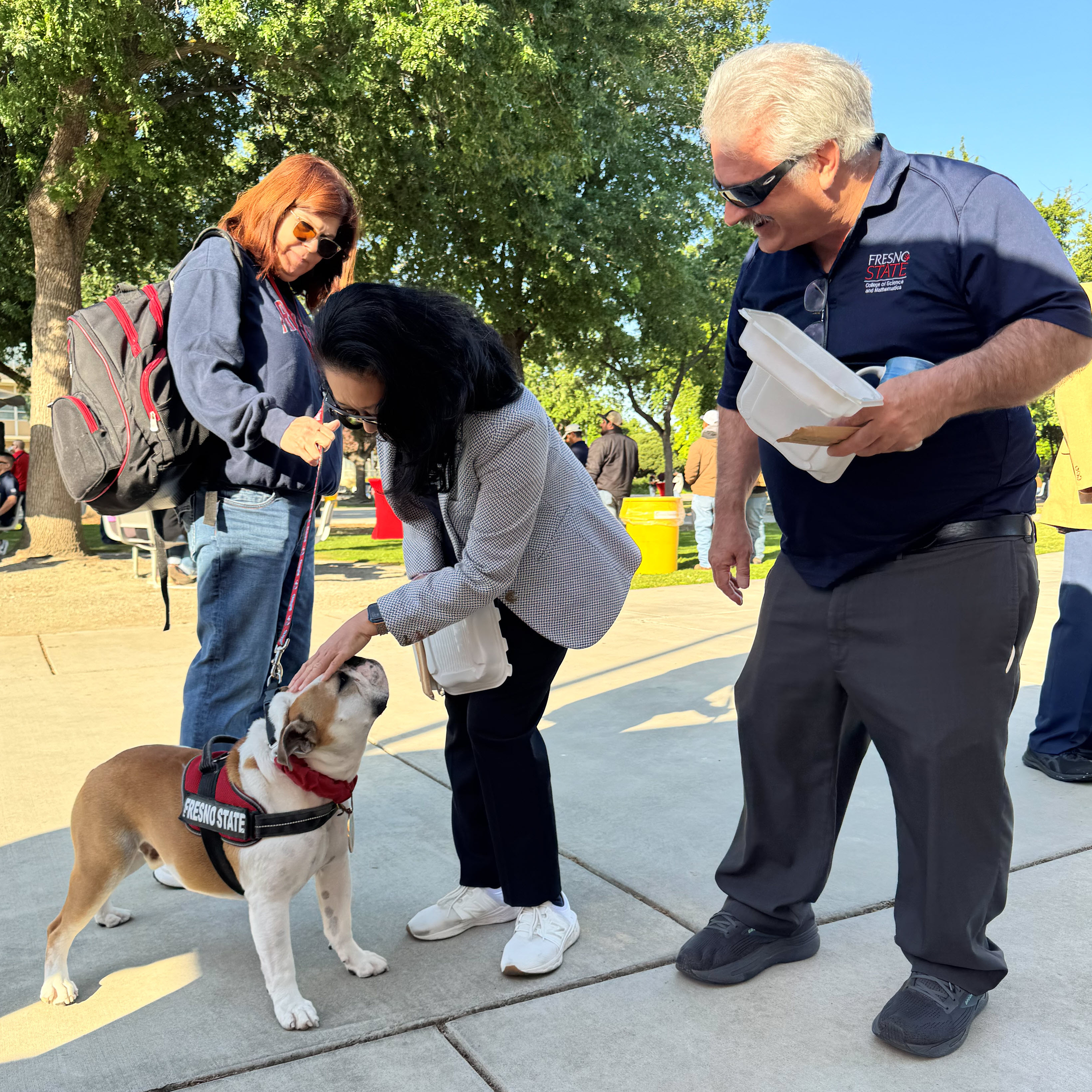 Associate Dean Goto and Dean Meyer greet Victor E. IV