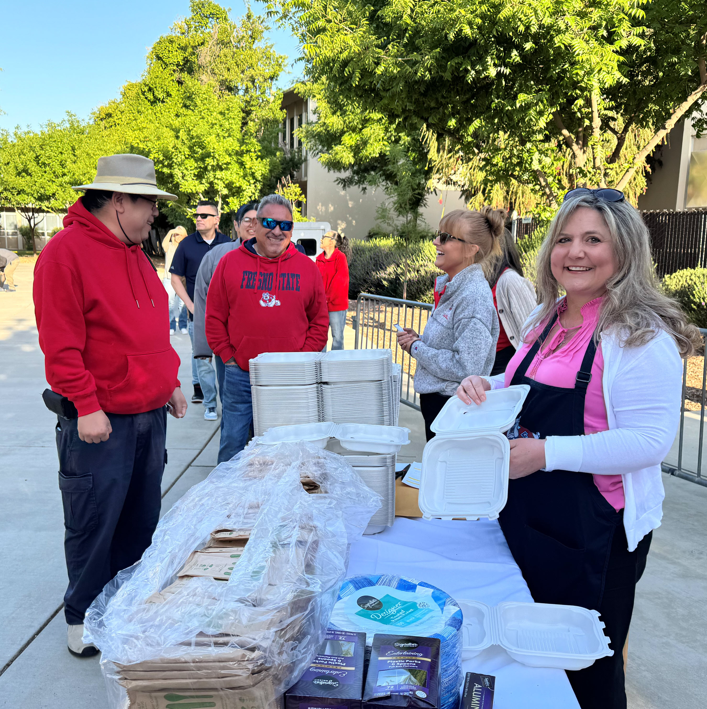 Dean Zografos passing out breakfast plates