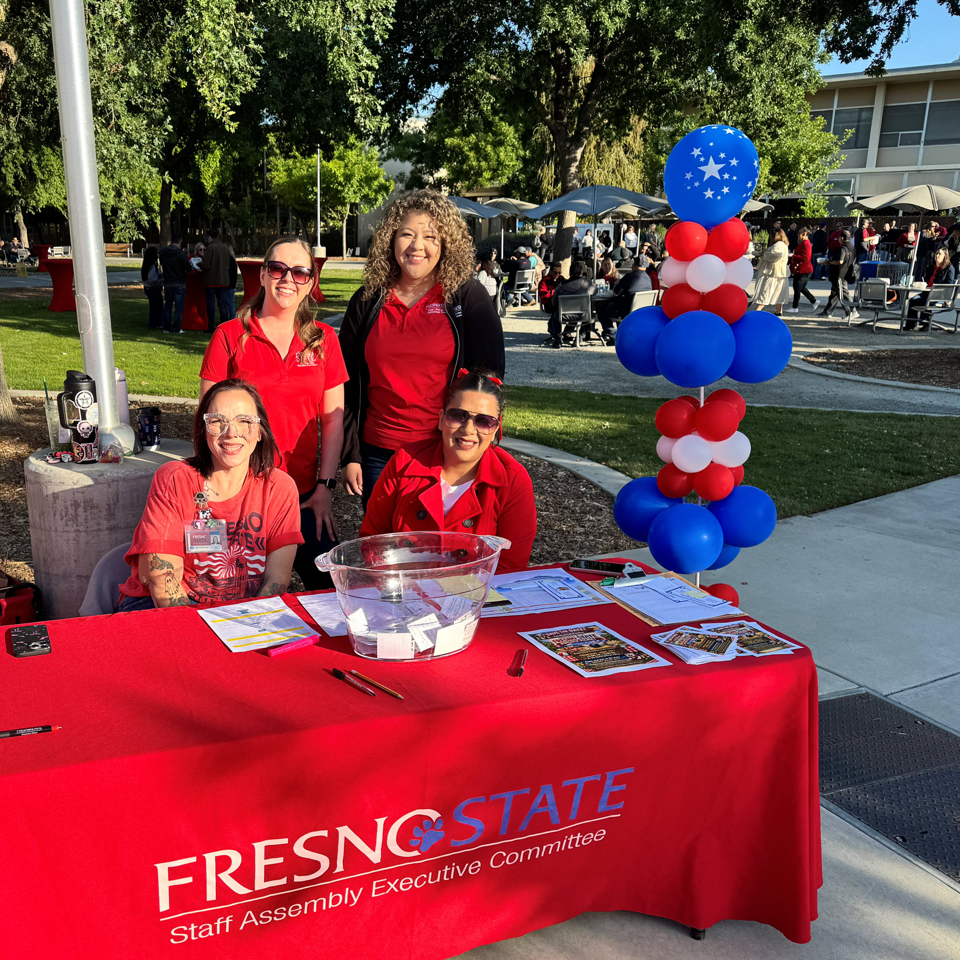 Four SAEC members at welcome table