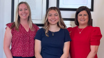 Three women smiling from the photo